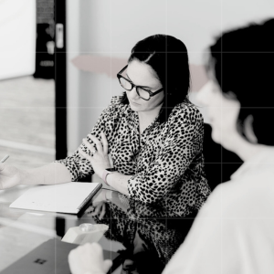 Team members discussing business strategy and planning in a business advisory session.