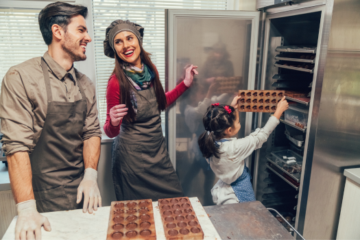 Family cooking in small business kitchen 