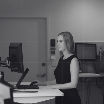 Close-up of a business accountant analysing financial reports, helping clients develop a strong business and cashflow plan for sustained success.