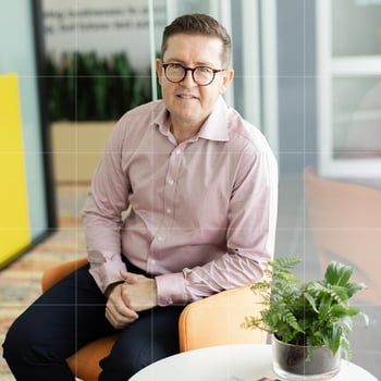 Business advisor from Trekk Advisory seated in a bright office lounge, ready to provide personalised business advisory support.