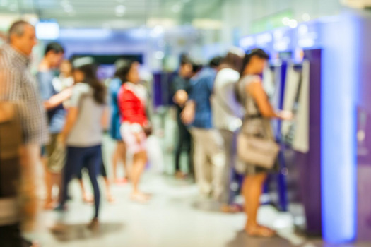 People line up at the ATM as banks respond to covid-19 and offer support.