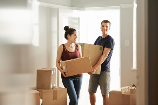 Couple moving into their new house as interest rates continue to rise.