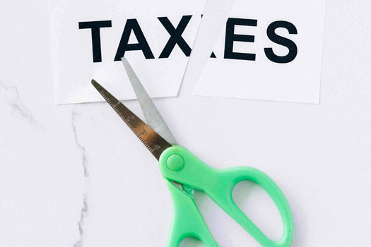 A scissor cutting taxes.