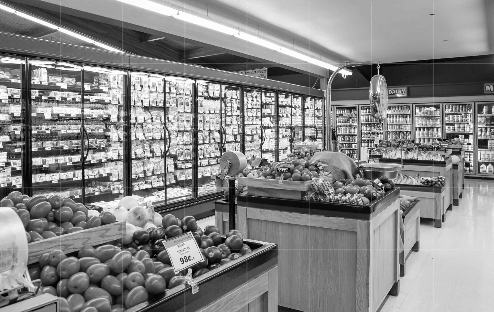 Supermarket produce and dairy aisles representing business operations and cash flow insights in business advisory.