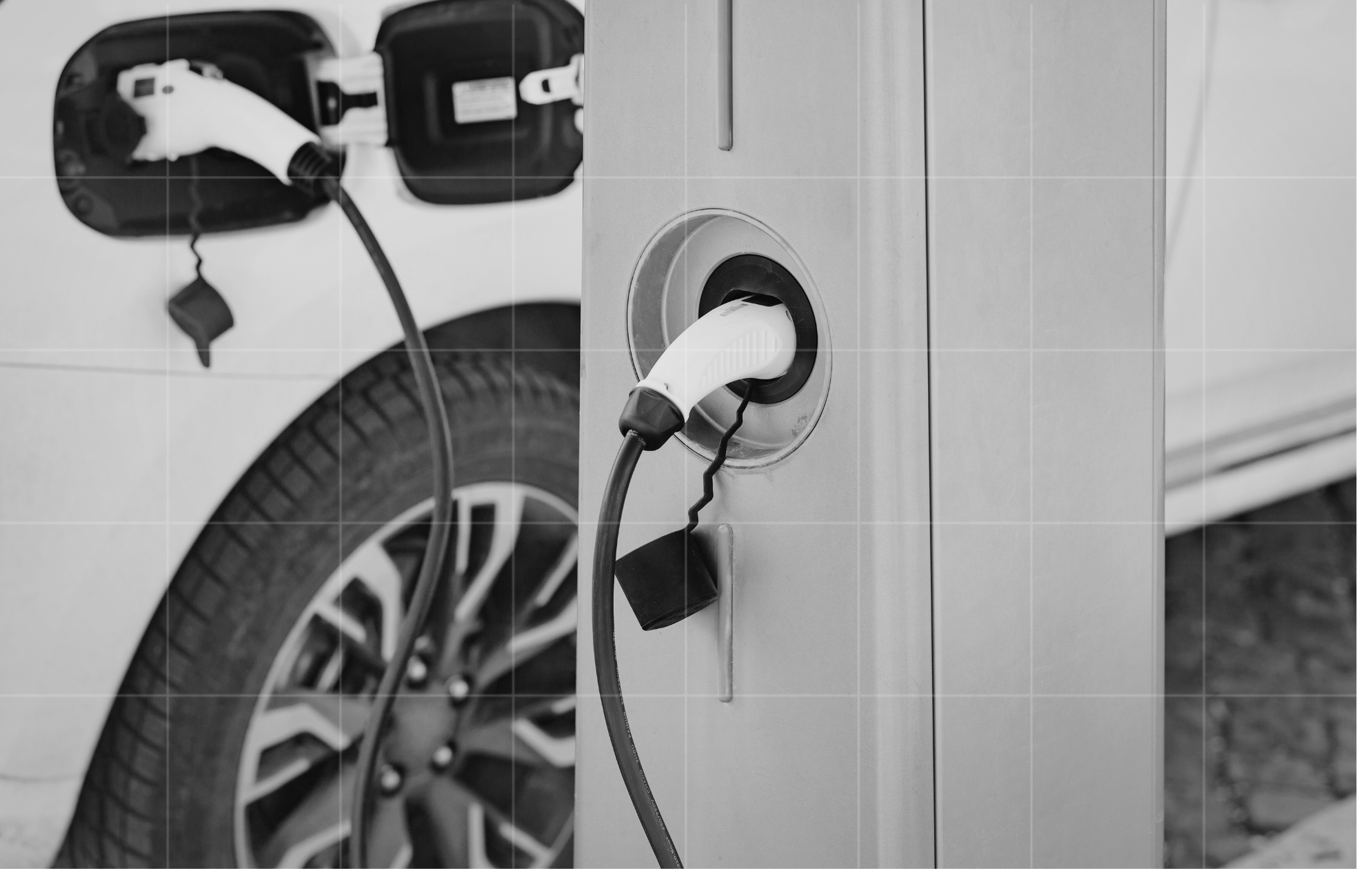Electric vehicle charging at a station, highlighting electric car tax discounts and business implications