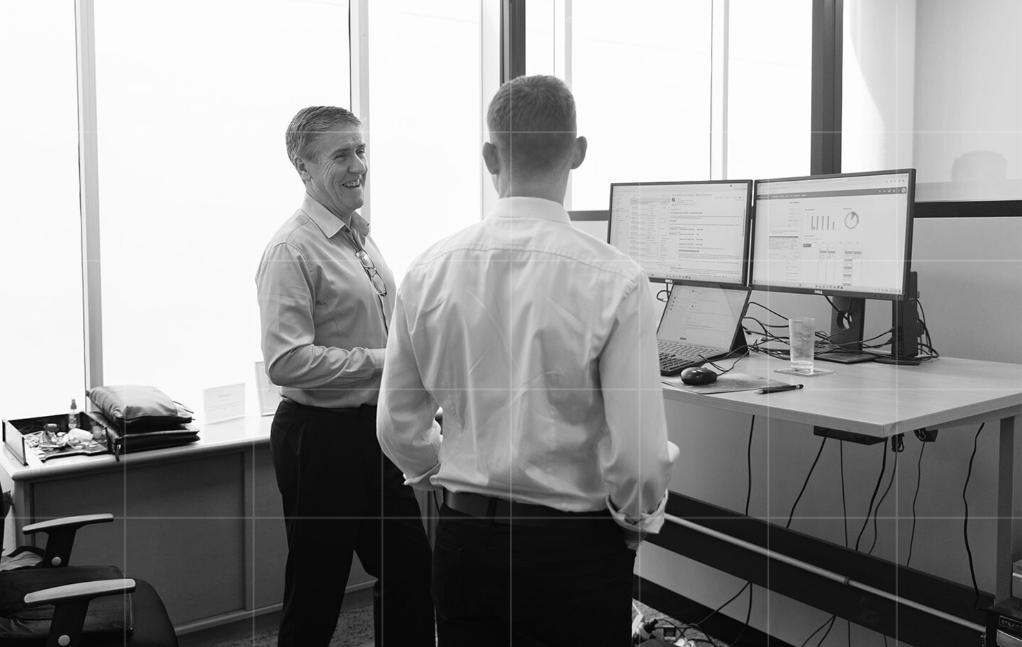 Trekk Advisory team members discussing financial strategy and performance insights in a business advisory consultation.